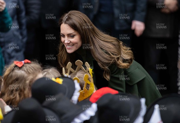 010322 - Picture shows the Duke and Duchess of Cambridge, Prince William and his wife Kate Middleton today meeting local school children as they leave Abergavenny Market today on St Davids Day in Wales