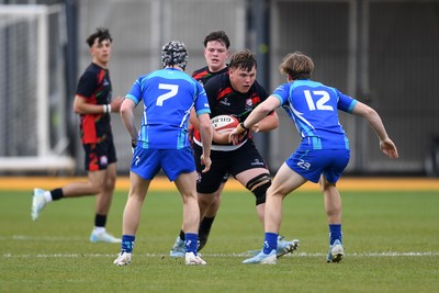 270426 - Dyffryn Taf v Bro Morgannwg - Road to Principality Finals - Boys U18s Cup - Kaynon Harries of Dyffryn Taf is challenged by Jack Evans of Bro Morganwg