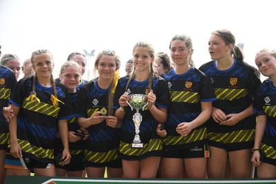 290426 - Dyffryn Taff v Bryncelynnog - Girls Schools Final U14 - Road To Principality Finals - Bryncelynnog players celebrate lifting the trophy at full time