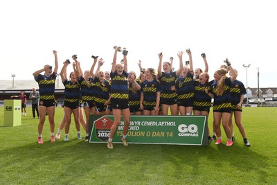 290426 - Dyffryn Taff v Bryncelynnog - Girls Schools Final U14 - Road To Principality Finals - Bryncelynnog players celebrate lifting the trophy at full time