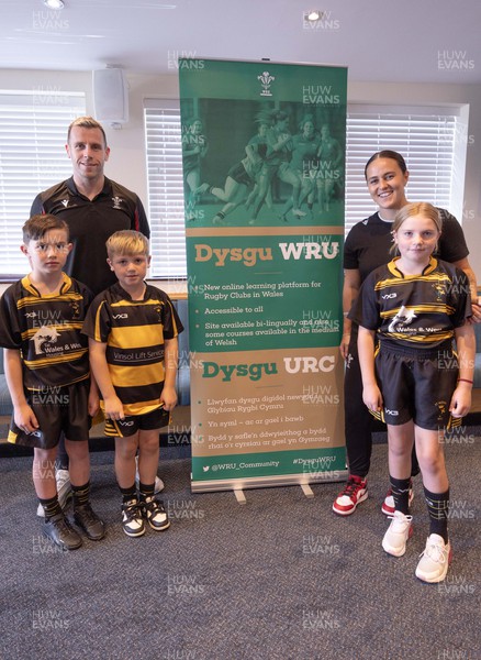 230823 - Dysgu WRU Launch, Old Penarthians RFC - Wales Men international Gareth Davies and Wales Women international Ffion Lewis with James Holloway, 9, Bobby Sherwood, 8 and Isabella Sherwood, 9, of of St Albans RFC, Tremorfa, at the launch of Dysgu WRU, a new online portal of educational resources for Welsh Rugby Union clubs 