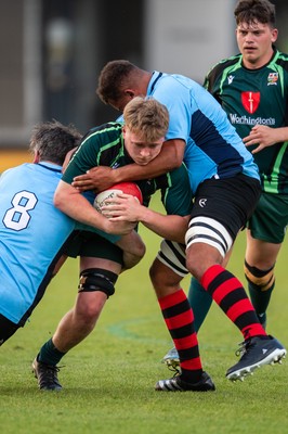 210525 - East District v Mid District - Inter District Cup Final - Issac Pritchard of Mid District is tackled by Rob Jones and Callum Samuel of East District