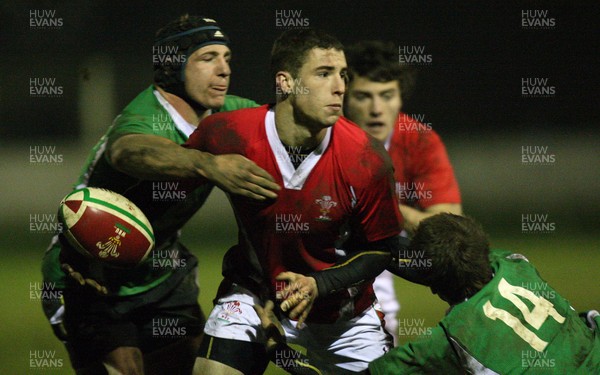 05.01.11.... Wales U20 East v Wales U20 West, Cross Keys -  West Wales' Steve Shingler is tackled by East Wales' Ross Wardle and Will Jones  