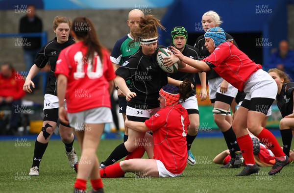 300417 - Under 18s Girls Rugby - East Wales v West Wales - Georgia Marsh of East Wales is tackled by Hatty Davies of West Wales 