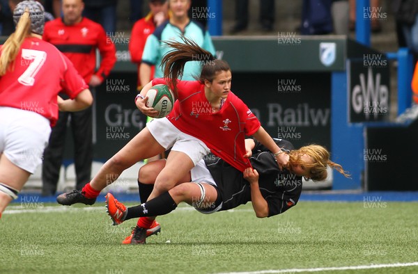 300417 - Under 18s Girls Rugby - East Wales v West Wales - Kayleigh Powell of West Wales is tackled by Manon Johnes of East Wales