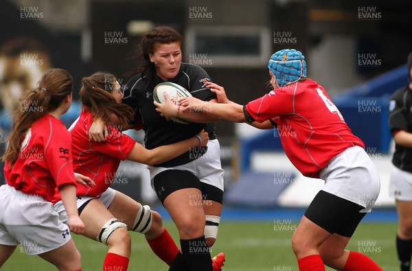 300417 - Under 18s Girls Rugby - East Wales v West Wales - Isla Lewis of East Wales is tackled by Gewn Crabb and Amy Morgan of West Wales