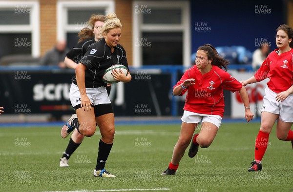 300417 - Under 18s Girls Rugby - East Wales v West Wales - Molly Philpot of East Wales takes on Kayleigh Powell of West Wales 