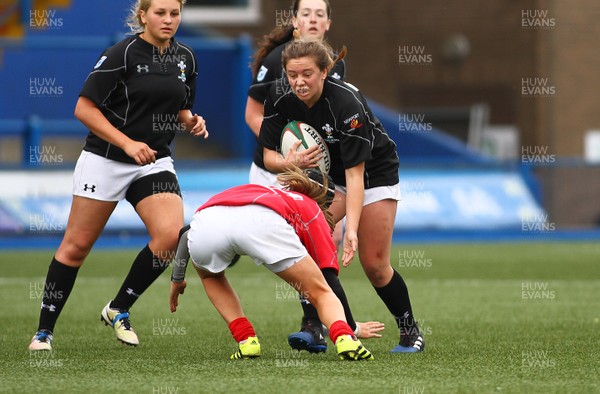 300417 - Under 18s Girls Rugby - East Wales v West Wales - Morganne Tuchli-Davies of East Wales takes on Lauren Smyth of West Wales