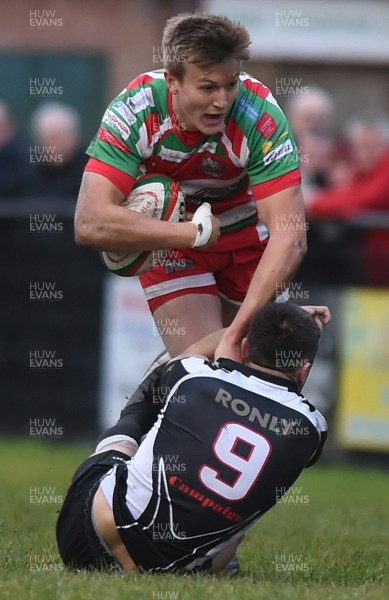 231217 - Ebbw Vale v Bedwas - Principality Premiership - Will Talbot Davies is tackled by Tom Rowlands of Bedwas
