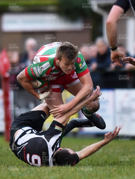 231217 - Ebbw Vale v Bedwas - Principality Premiership - Will Talbot Davies is tackled by Tom Rowlands of Bedwas