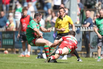 100525 - Ebbw Vale v Llandovery - Super Rygbi Cymru (SRC) Semi Final - Ryan Gardner of Ebbw Vale fends off Llien Morgan of Llandovery 