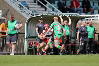 100525 - Ebbw Vale v Llandovery - Super Rygbi Cymru (SRC) Semi Final - Harri Doel of Llandovery attacks Ieuan Evans of Ebbw Vale