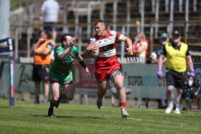 100525 - Ebbw Vale v Llandovery - Super Rygbi Cymru (SRC) Semi Final - Taylor Davies of Llandovery evades Gruff Tough of Ebbw Vale