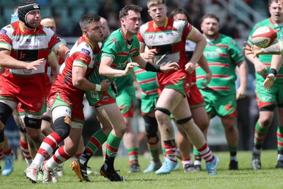 100525 - Ebbw Vale v Llandovery - Super Rygbi Cymru (SRC) Semi Final - Gruff Tough of Ebbw Vale offloads under pressure from Ioan Hughes of Llandovery 