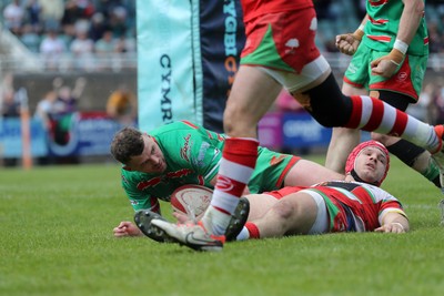 100525 - Ebbw Vale v Llandovery - Super Rygbi Cymru (SRC) Semi Final - Harri Doel of Llandovery cant stop Ethan Phillips of Ebbw Vale heading toward the try line 