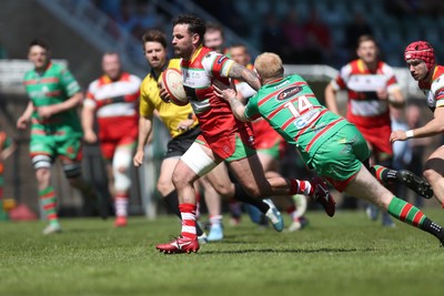 100525 - Ebbw Vale v Llandovery - Super Rygbi Cymru (SRC) Semi Final - Rhodri Jones of Llandovery hands off Ieuan Evans of Ebbw Vale