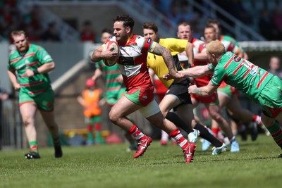 100525 - Ebbw Vale v Llandovery - Super Rygbi Cymru (SRC) Semi Final - Rhodri Jones of Llandovery breaks away from Ieuan Evans of Ebbw Vale to score a try