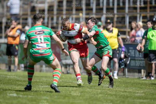 100525 - Ebbw Vale v Llandovery - Super Rygbi Cymru (SRC) Semi Final - Taylor Davies of Llandovery is tackled by Gruff Tough of Ebbw Vale