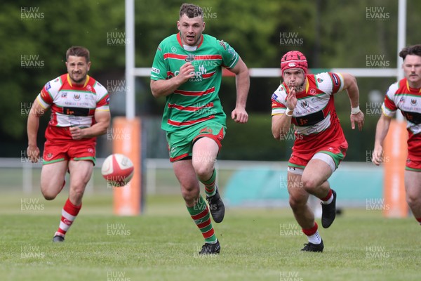100525 - Ebbw Vale v Llandovery - Super Rygbi Cymru (SRC) Semi Final - Ethan Phillips of Ebbw Vale kicks ahead to score a try under pressure from Harri Doel of Llandovery