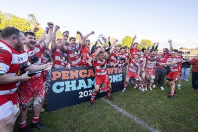 100526 - Ebbw Vale v Llandovery RFC - Super Rygbi Cymru Grand Final - Lee Rees of Llandovery lifts the trophy alongside his team mates