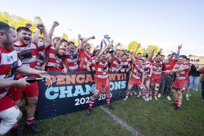 100526 - Ebbw Vale v Llandovery RFC - Super Rygbi Cymru Grand Final - Lee Rees of Llandovery lifts the trophy alongside his team mates