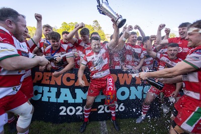 100526 - Ebbw Vale v Llandovery RFC - Super Rygbi Cymru Grand Final - Lee Rees of Llandovery lifts the trophy alongside his team mates