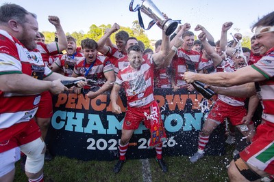 100526 - Ebbw Vale v Llandovery RFC - Super Rygbi Cymru Grand Final - Lee Rees of Llandovery lifts the trophy alongside his team mates