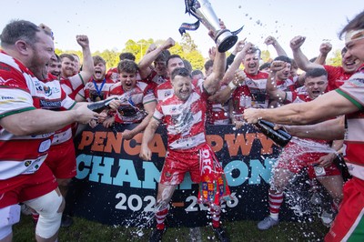 100526 - Ebbw Vale v Llandovery RFC - Super Rygbi Cymru Grand Final - Lee Rees of Llandovery lifts the trophy alongside his team mates