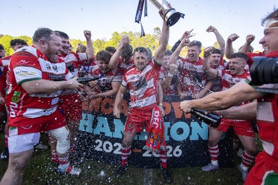 100526 - Ebbw Vale v Llandovery RFC - Super Rygbi Cymru Grand Final - Lee Rees of Llandovery lifts the trophy alongside his team mates