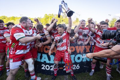 100526 - Ebbw Vale v Llandovery RFC - Super Rygbi Cymru Grand Final - Lee Rees of Llandovery lifts the trophy alongside his team mates