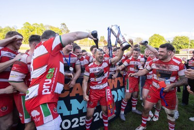 100526 - Ebbw Vale v Llandovery RFC - Super Rygbi Cymru Grand Final - Lee Rees of Llandovery lifts the trophy alongside his team mates