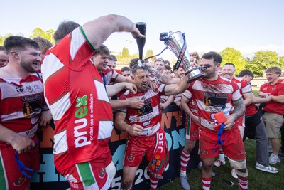 100526 - Ebbw Vale v Llandovery RFC - Super Rygbi Cymru Grand Final - Lee Rees of Llandovery lifts the trophy alongside his team mates