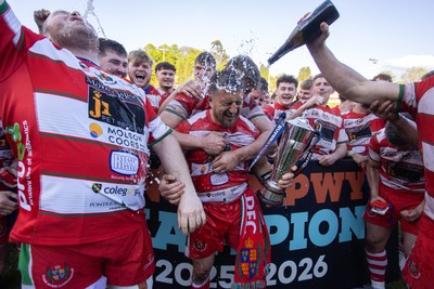 100526 - Ebbw Vale v Llandovery RFC - Super Rygbi Cymru Grand Final - Lee Rees of Llandovery lifts the trophy alongside his team mates