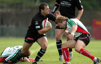 160906 - Ebbw Vale v Neath - The Principality Premiership - Neath's Stephen Thomas is tackled by Andrew McLaughlan(lt) and Tom Edwards 