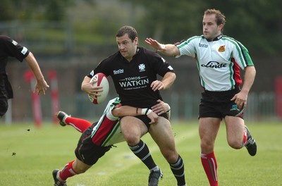 160906 - Ebbw Vale v Neath - The Principality Premiership - Neath's Stephen Thomas is tackled by Andrew McLaughlan 