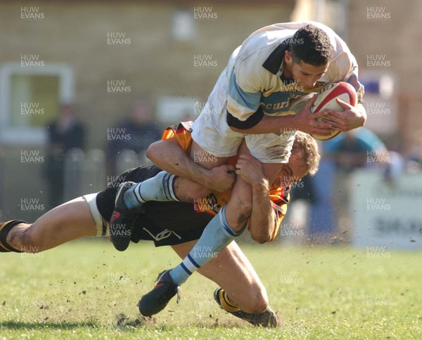 050403 - Ebbw Vale v Newport - Principality Cup Quarter Final - Ebbw's Nick Wakley is tackled by Jason Jones-Hughes