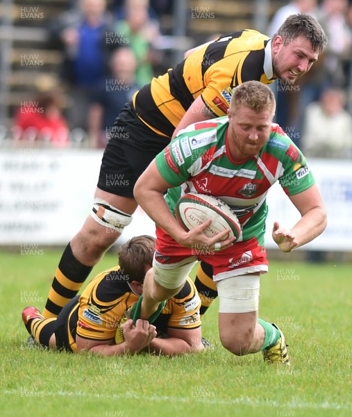 160917 - Ebbw Vale v Newport - Principality Premiership - Ebbw's Jonathan Davies tackled by Newport's Henry Palmer and Joe Bartlett