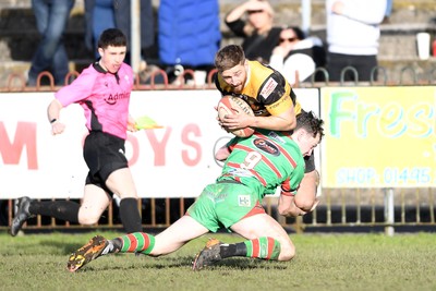 010325 - Ebbw Vale v Newport - Super Rygbi Cymru - Chay Foster-Smith of Newport is challenged by Gruff Tough of Ebbw Vale