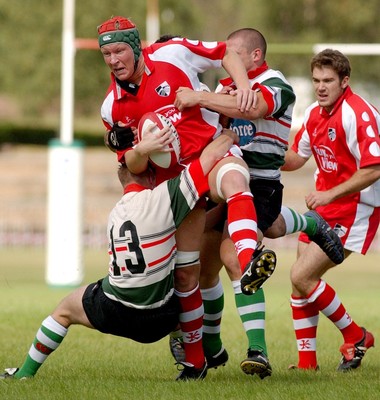 060903 - Ebbw Vale v Pontypridd - Welsh Premiership - Ponty's Dan Godfrey gets slowed by Ebbw Vale's defence