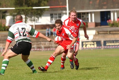 060903 - Ebbw Vale v Pontypridd - Welsh Premiership - Ponty's Kristian Owen sidesteps Tim Bagg