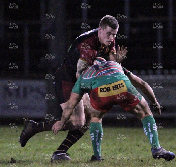 110119 - Ebbw Vale v RGC - Principality Premiership -  Tom Hughes of RGC is tackled by Dom Franchie of Ebbw Vale
