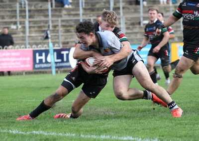 260926 - Ebbw Vale v RGC - Super Rygbi Cymru (SRC) - Tudor Jones of RGC is tackled by Harry Ford of Ebbw Vale