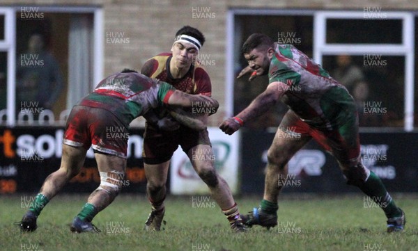 060118 - Ebbw Vale v RGC1404 - WRU National Cup -  Jacob Botica of RGC1404 is tackled by Dominic Franchi of Ebbw Vale