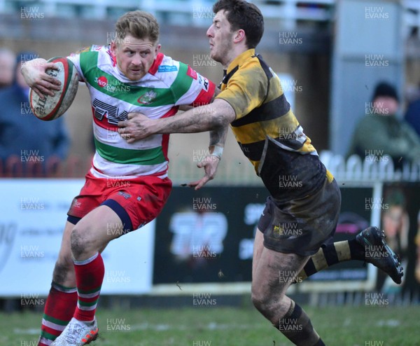 280117 - Ebbw Vale v Skewen-National Cup round 1-Ebbw's Daniel Haymond tackled by Skewens Jordan Adderley