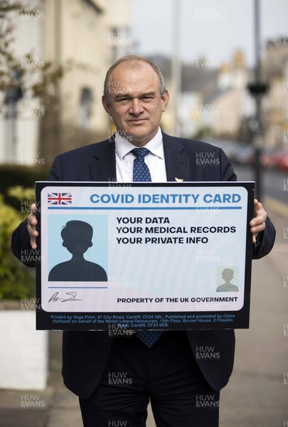 200421 - Liberal Democrats Campaigning in Cowbridge, South Wales - Ed Davey holds a Covid ID card as the party opposes the proposed idea