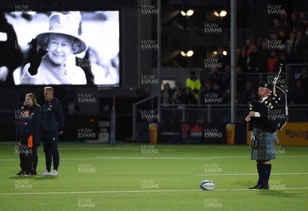 170922 - Edinburgh Rugby v Dragons RFC - United Rugby Championship - A lone piper plays during a minutes silence before kick off in remembrance and respect following the passing of Queen Elizabeth II