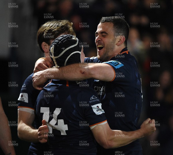 150423 - Edinburgh Rugby v Ospreys - United Rugby Championship - Darcy Graham of Edinburgh celebrates with Emiliano Boffelli (R) after scoring his second try of the match