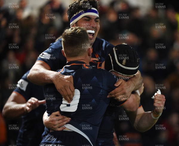 150423 - Edinburgh Rugby v Ospreys - United Rugby Championship - Darcy Graham of Edinburgh celebrates his first try of the match with Stuart McInally and Ben Vellacott (9)