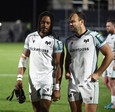 291125 - Edinburgh Rugby v Ospreys - United Rugby Championship - Daniel Kasende of Ospreys and Evardi Boshoff of Ospreys (R) leave the field dejected at the end of the match following a narrow 19-17 defeat