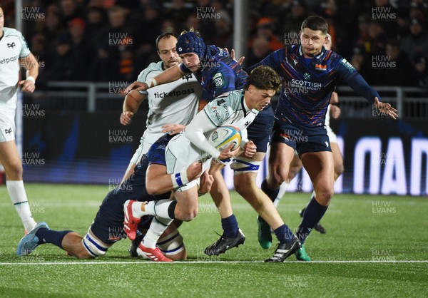 291125 - Edinburgh Rugby v Ospreys - United Rugby Championship - Jack Walsh of Ospreys is hauled down by the Edinburgh defence